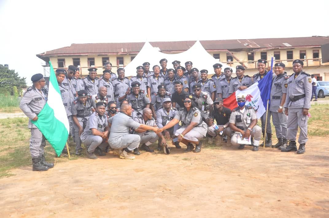 CHAPOL corps group photo with Nigerian and CHAPOL flags